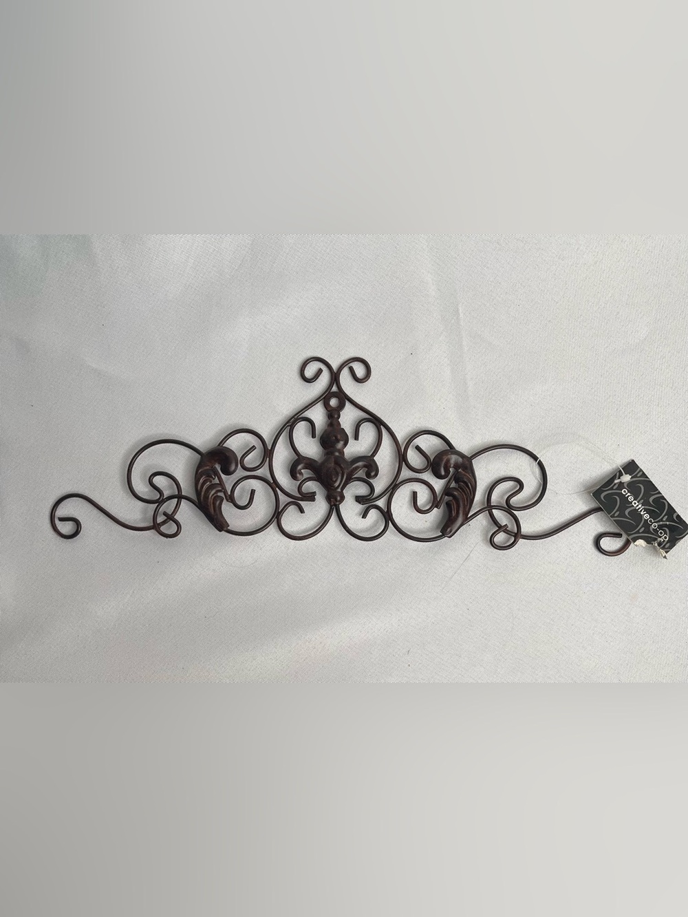 Ornate Metal Wall Accent in Antique Brown - Decorative Scrollwork
